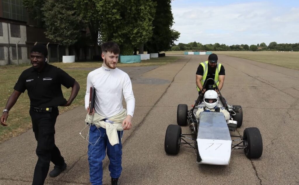 Salim and Ben on test day with the car at Bicester Motion.