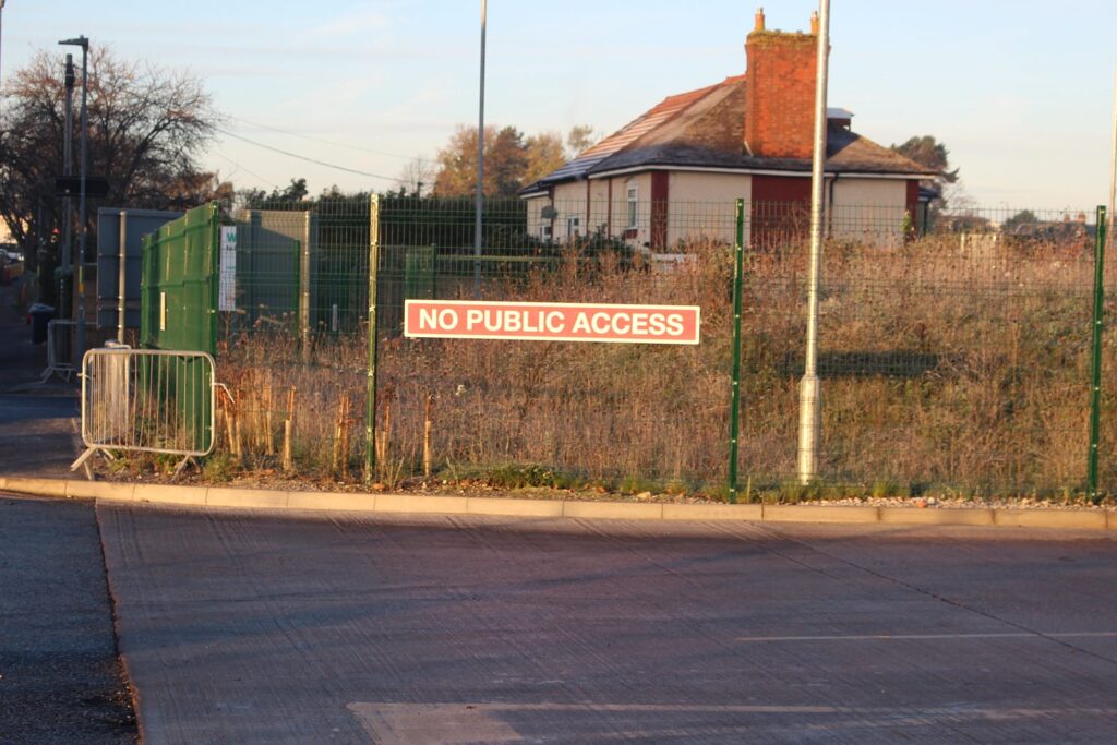 A sign reads "no public access" on the gates leading into the Perry Barr depot.