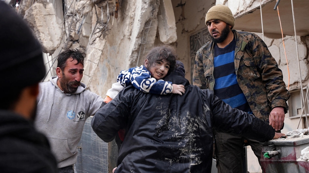 People in the rubble following the earthquake which hit Turkey and Syria