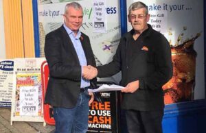Cllr Ewan Mackey receiving the petition from Peter Harding